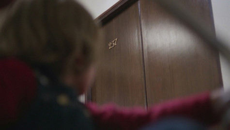 Danny glancing at Room 237 in "The Shining."