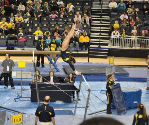 Sachi Sugiyama performs a release from high bar to the low bar.