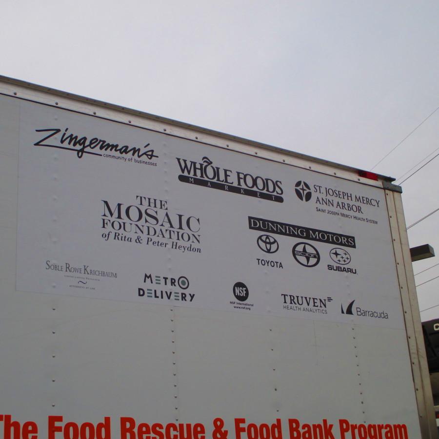 Food Gatherer’s Trucks display the many sponsors that fund the organization. Zingerman’s (top left) is the founding business that started Food Gatherers. Notice the variety of businesses, both food and non-food donors. 