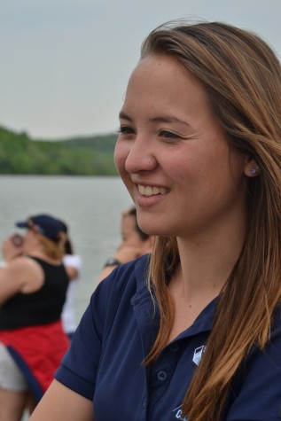 Novice women's coach, Eila West waits happily to watch the next Skyline boat to come down the course.