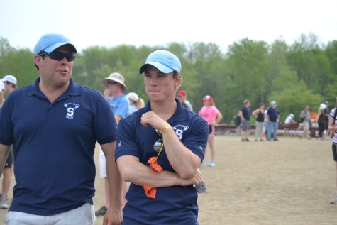 Coaches Kit Bennett and Ben Frey wait for Skyline's Women's Light Weight Double to return after finishing first.