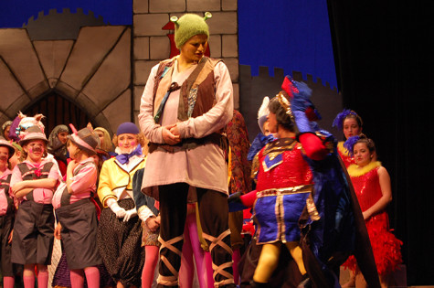 The show was adapted from the popular film about an ogre, Shrek, who falls in love with a princess, Fiona. Aris Chalin, a CHS freshman, played Shrek. “It’s definitely a more modern show,” Chalin said. Along with a not-so-classic love story, the musical tells how the fairytale creatures, exiled as “freaks” from Lord Farquaad’s Kingdom, embrace their differences.