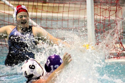 Leah Weingarten, #13 for Pioneer, scores her first goal on Dawn Hakwins, goalie for Okemos, in the third quarter.