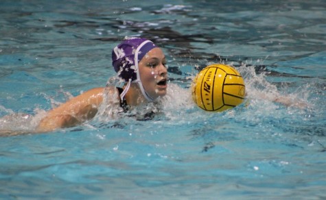 Abbey Stepnitz sprints down the pool on a breakaway after Michelle Syer passed her the ball.