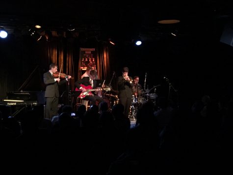 Gabe Kleer, Liam Knight, Joel Appel-Kraut, Lucas Atkinsmith, and Brendan O'Rielly perform in their band in Acoustic Fission.